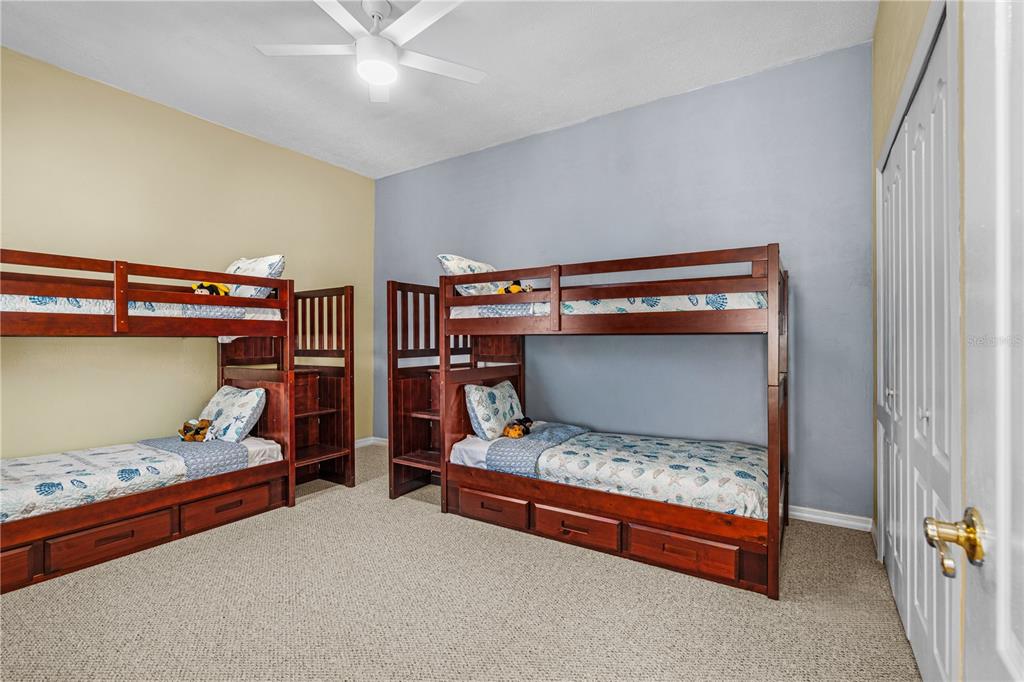 124 Rose Bank Road Daytona Beach, FL 32114 - Photo 36 of 43 a bedroom with bunk bed and a window