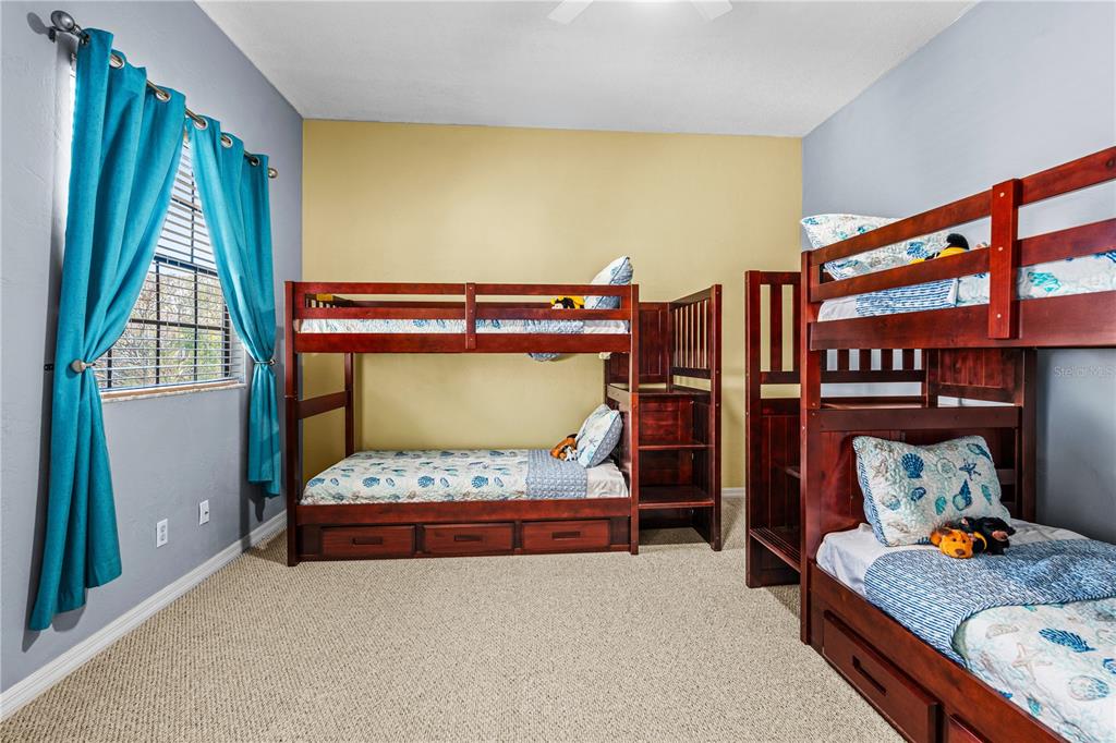 124 Rose Bank Road Daytona Beach, FL 32114 - Photo 37 of 43 a bedroom with furniture and a window