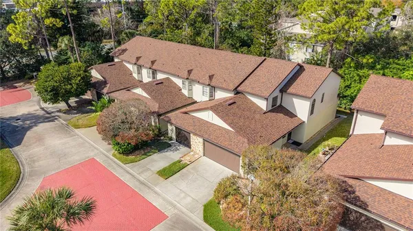 an aerial view of a house with a garden