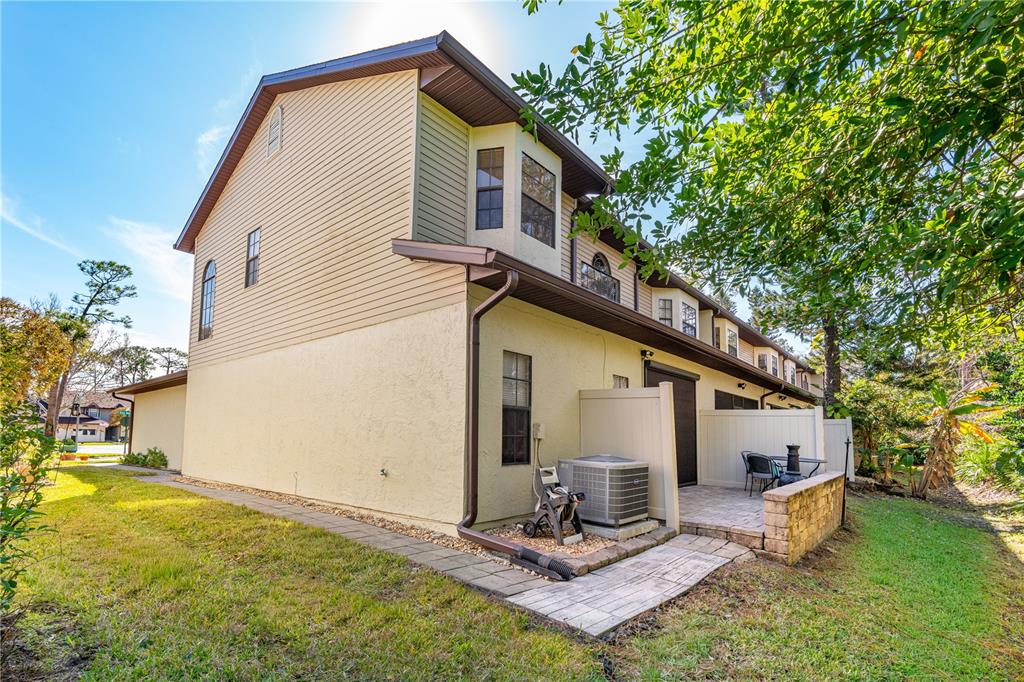 124 Rose Bank Road Daytona Beach, FL 32114 - Photo 6 of 43 a view of a house with backyard and sitting area