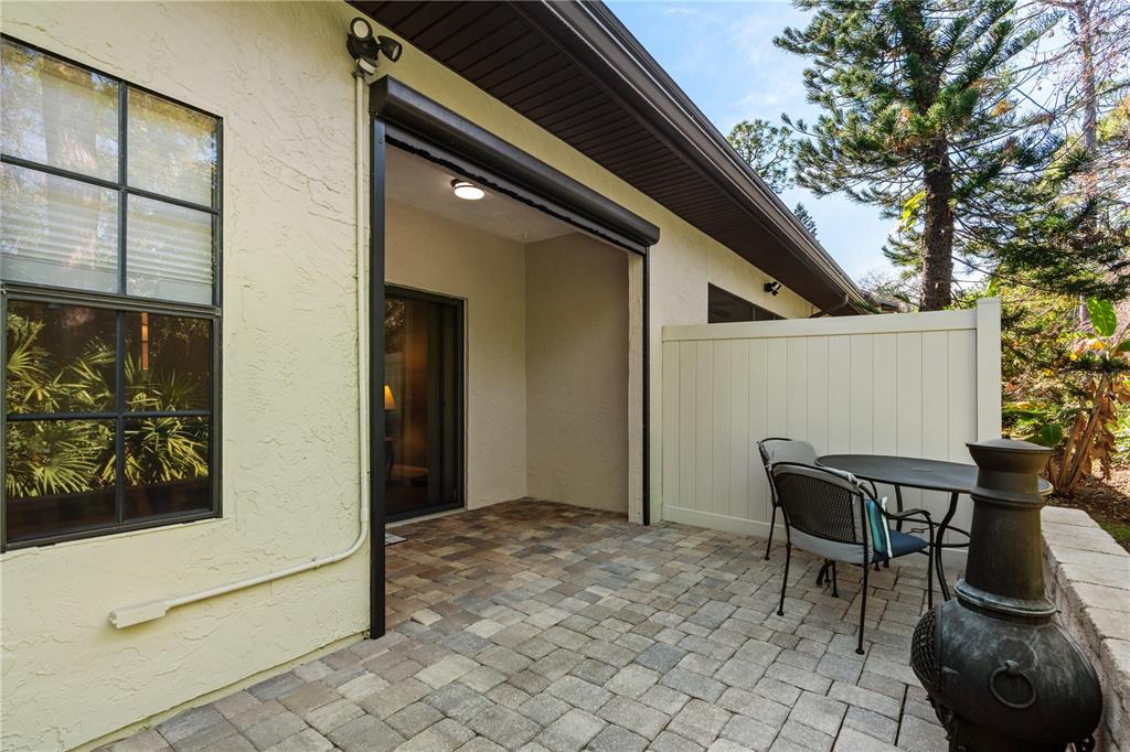 124 Rose Bank Road Daytona Beach, FL 32114 - Photo 10 of 43 a backyard of a house with table and chairs