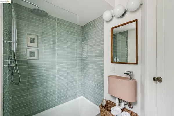 a white bath tub sitting next to a white sink