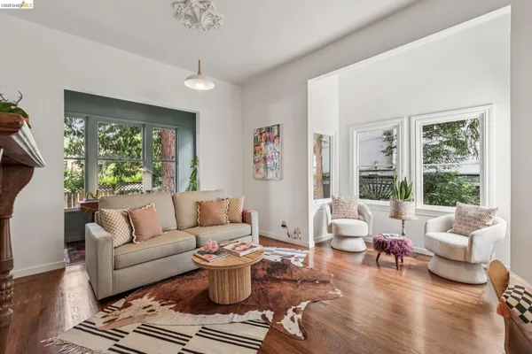 a living room with furniture or couch and a large window