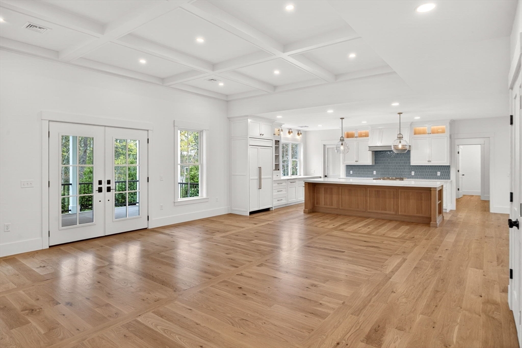 132 Great Western Road Harwich, MA 02645 - Photo 7 of 42 a large kitchen with stainless steel appliances granite countertop a large counter top a wooden floors and a large window