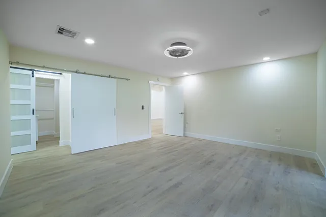 a bathroom with a double vanity sink mirror and shower