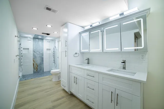 a bathroom with a shower and toilet