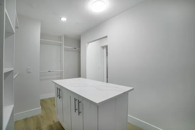 a kitchen with a sink and cabinets