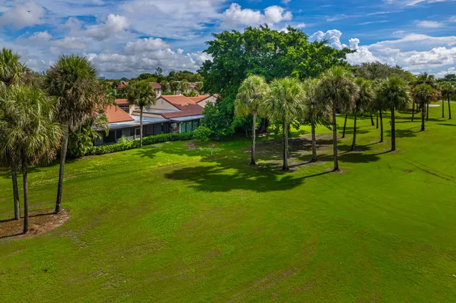 a front view of house with yard and outdoor seating