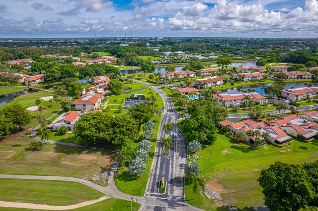 an aerial view of a golf course with parking space