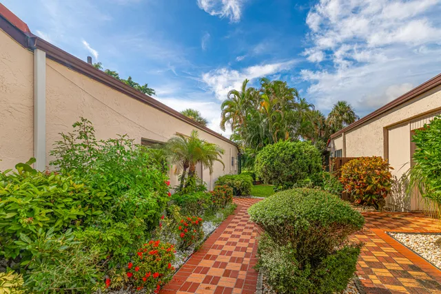a view of a pathway with a yard