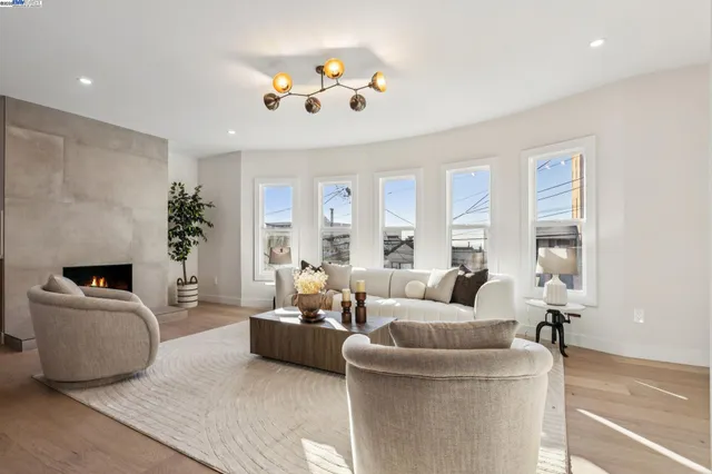 a living room with furniture potted plant and a fireplace