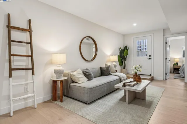 a bedroom with bed and a potted plant