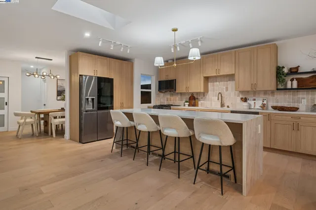 a spacious bathroom with a double vanity sink and a mirror
