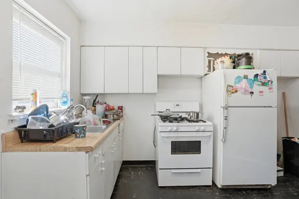 a view of a dining room with furniture and a flat screen tv