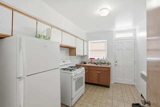 a bedroom with bed and window