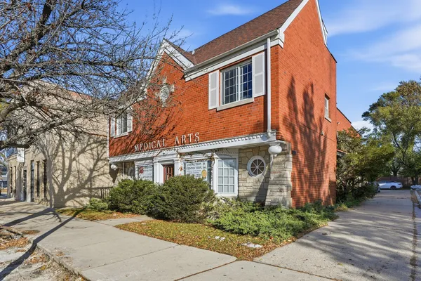 a view of a street with a building in the background