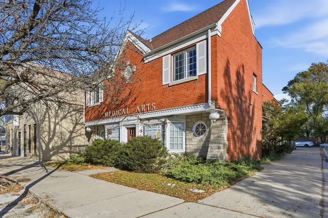 a view of a street with a building in the background