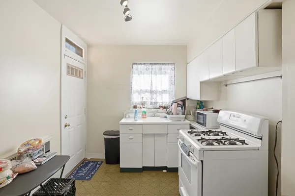 a living room with furniture and a mirror