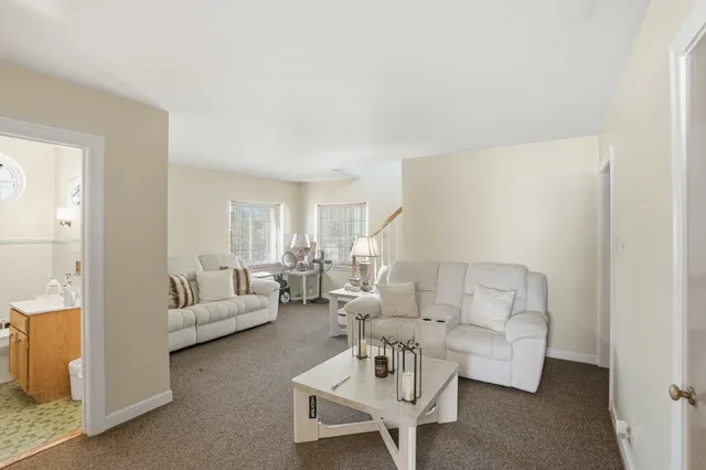 a bathroom with a sink a toilet and shower curtain