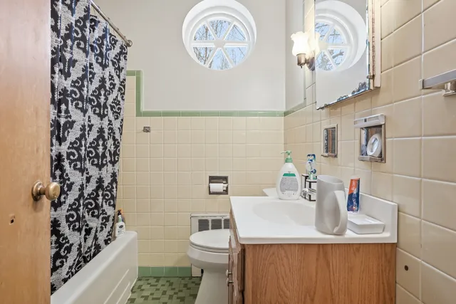 a view of a room with wooden floor and windows