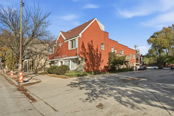 an aerial view of a house with a ocean view