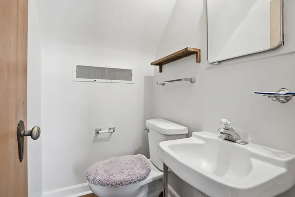 a living room with furniture a chandelier and a fireplace