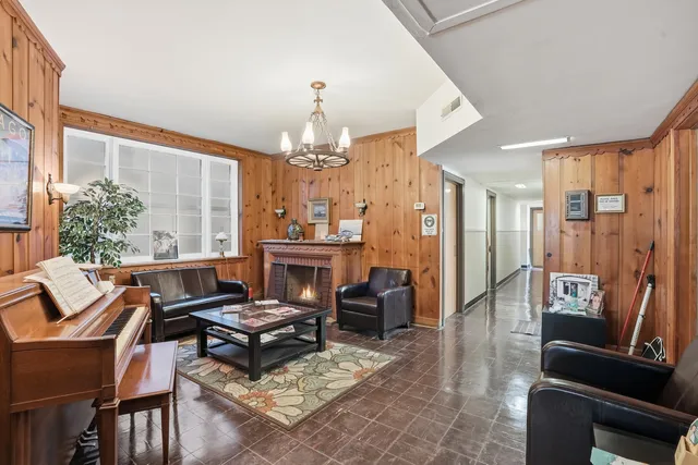 a bathroom with a granite countertop sink a toilet and a mirror