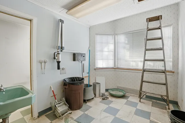 a view of a room with furniture and window