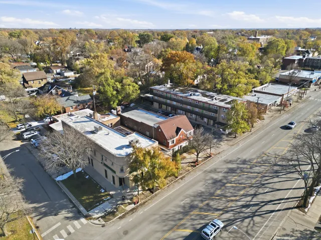 an aerial view of residential houses with outdoor space