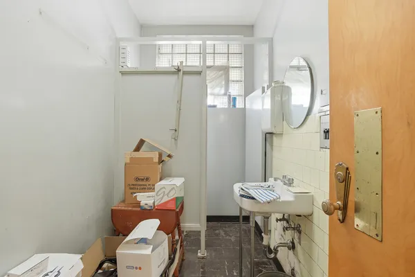 a view of a room that has a bed and a window