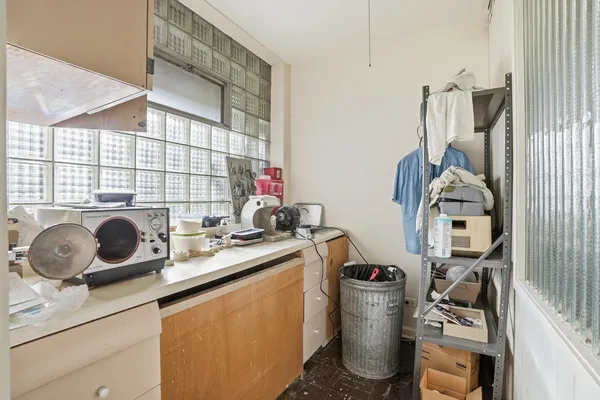 a room with a cabinets and window