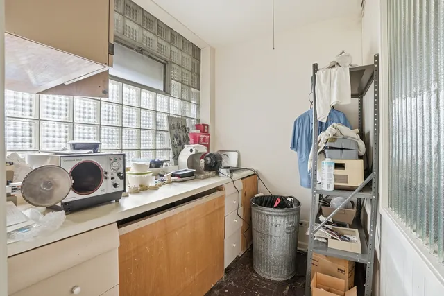 a room with a cabinets and window