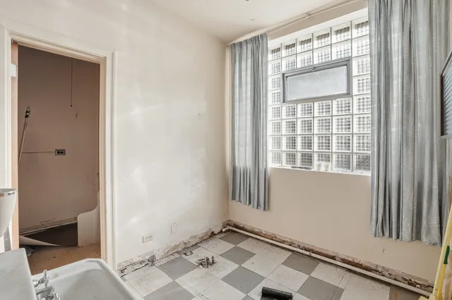 a view of a chairs and table in a patio