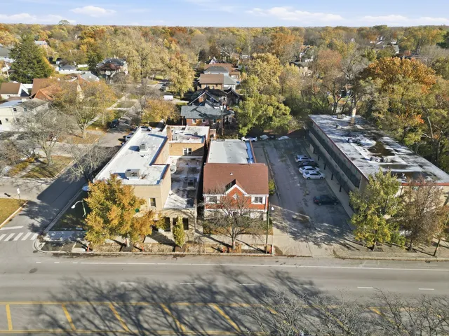 an aerial view of residential houses with outdoor space