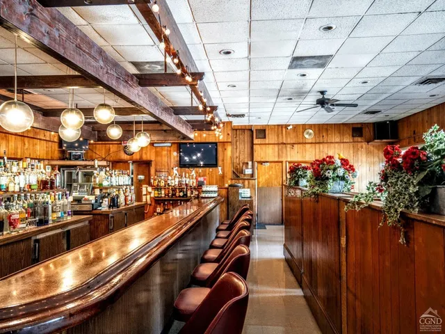 a view of a chairs and table in a balcony