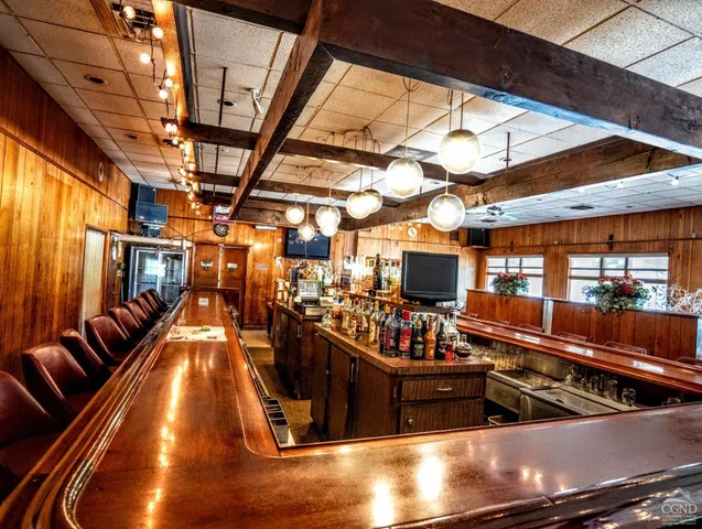 a view of a chairs and table in a room