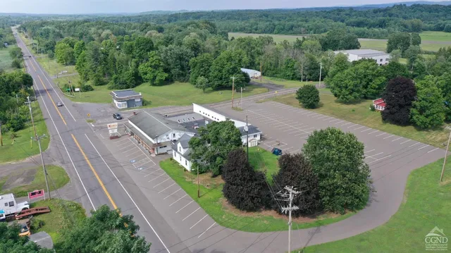 an aerial view of a house with outdoor space