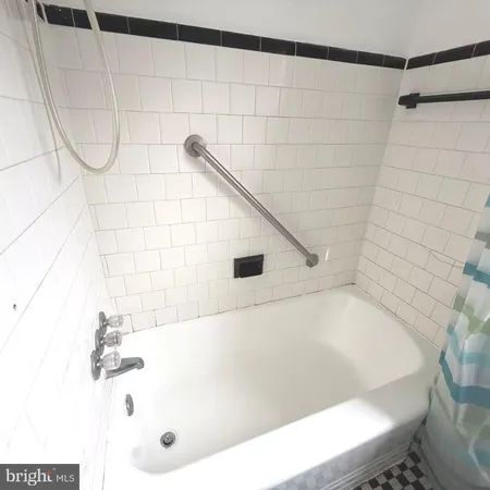 a bathroom with a sink toilet and a mirror