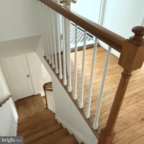 a view of staircase with large windows