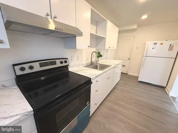 a kitchen with a stove and a microwave