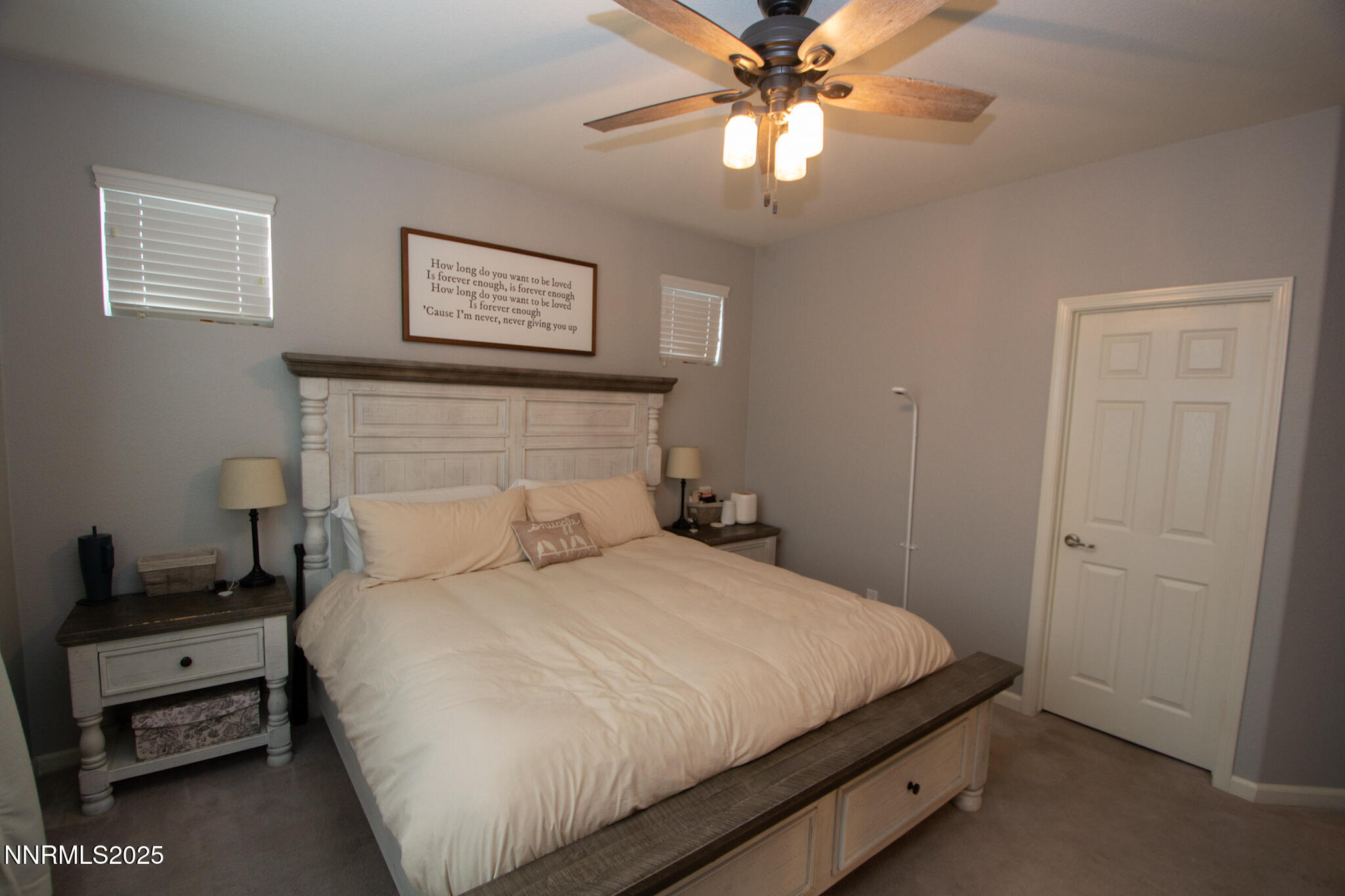 1056 Crown View Drive Reno, NV 89523 - Photo 11 of 27 a bedroom with a bed and a chandelier