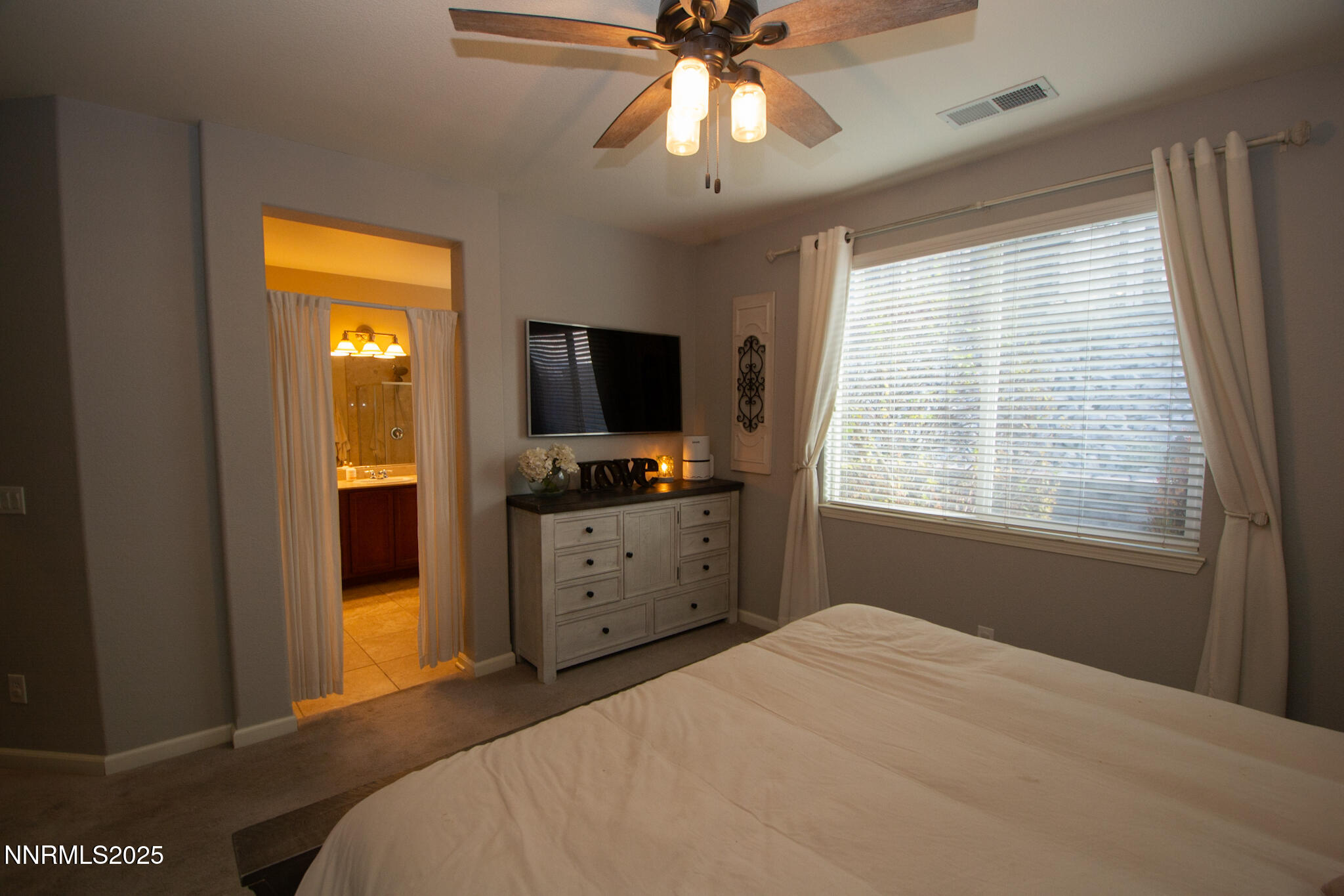 1056 Crown View Drive Reno, NV 89523 - Photo 12 of 27 a bedroom with a bed and a window