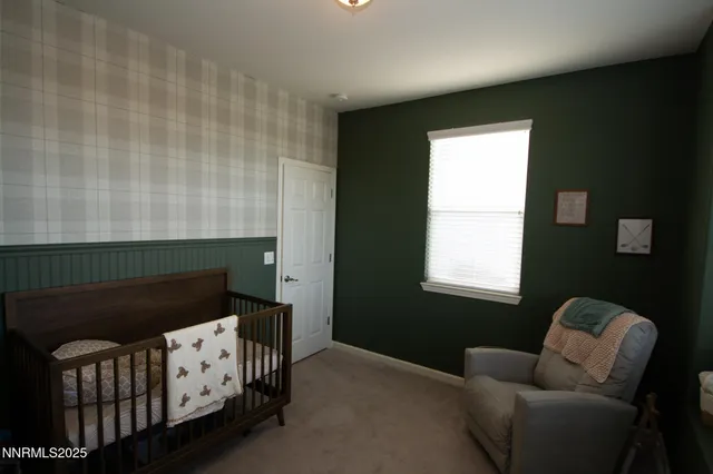 a bedroom with furniture and a window