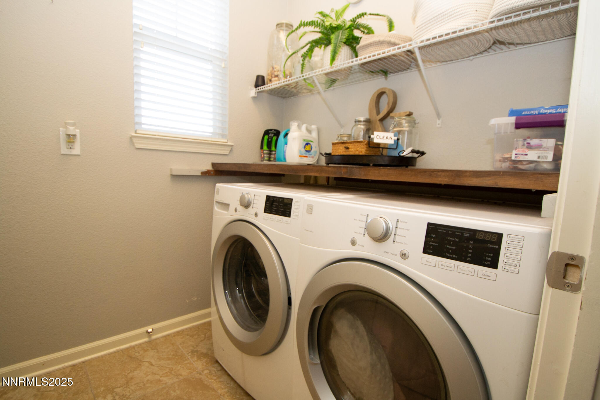 1056 Crown View Drive Reno, NV 89523 - Photo 21 of 27 a utility room with dryer and washer