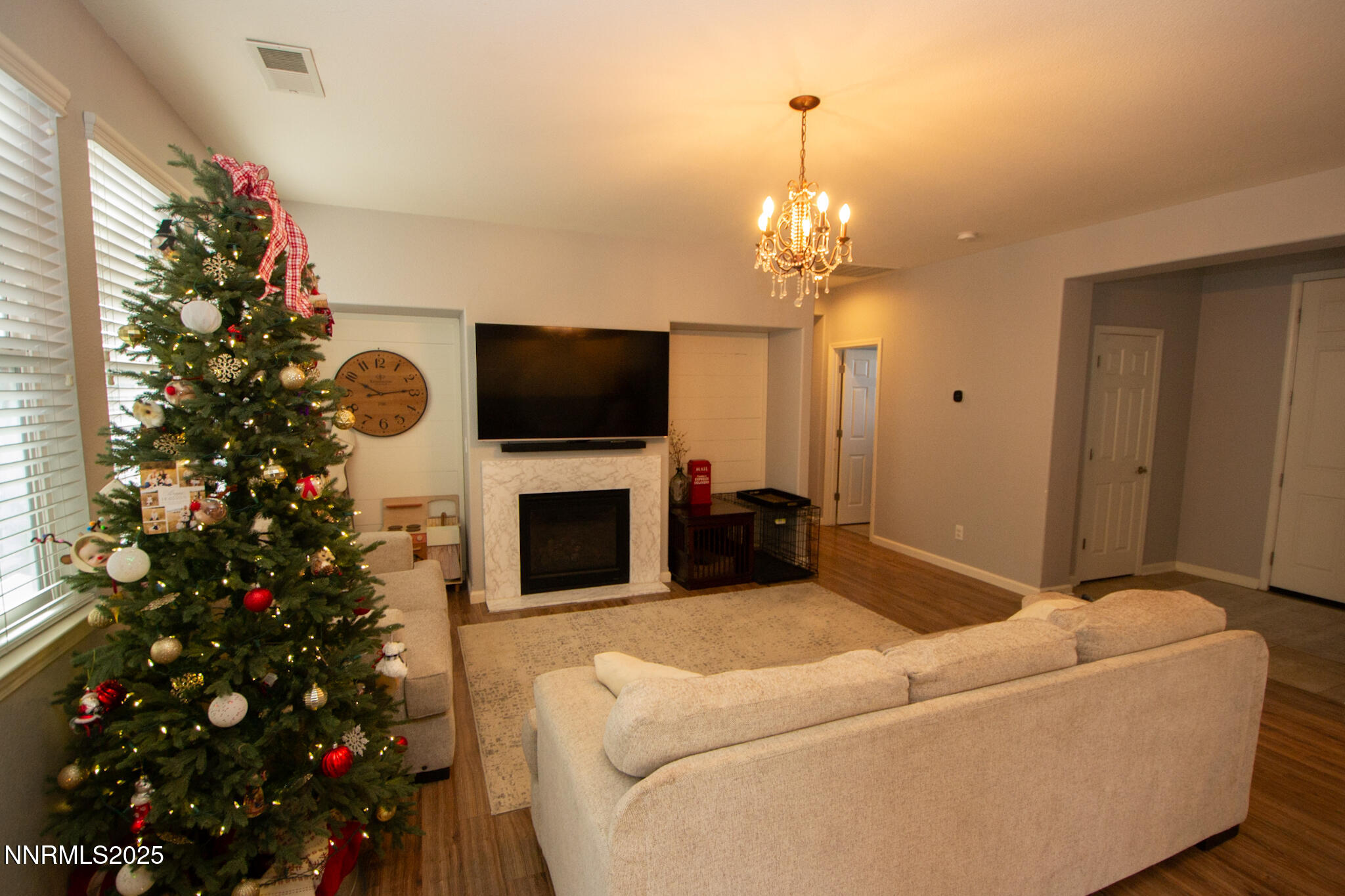 1056 Crown View Drive Reno, NV 89523 - Photo 4 of 27 a living room with a flat screen tv and a christmas tree