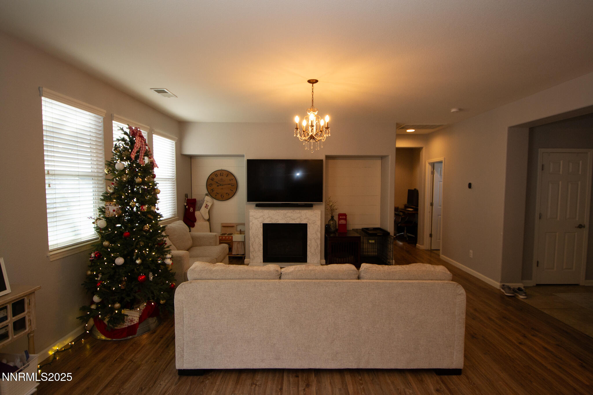 1056 Crown View Drive Reno, NV 89523 - Photo 5 of 27 a living room with furniture a fireplace and a potted plant