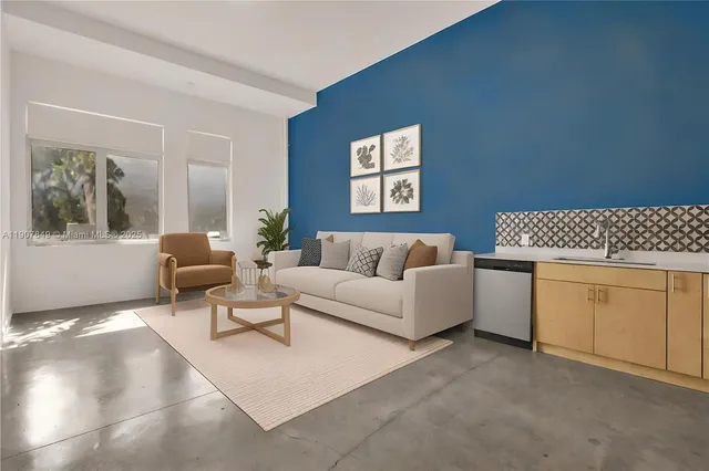 a living room with furniture and a window