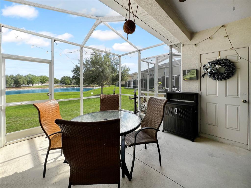 15767 Stable Run Drive Spring Hill, FL 34610 - Photo 16 of 34 a view of a patio with a table chairs and a backyard