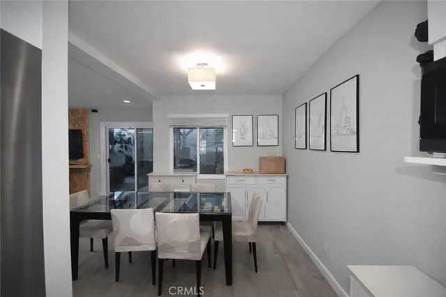 a view of a dining room with furniture and window