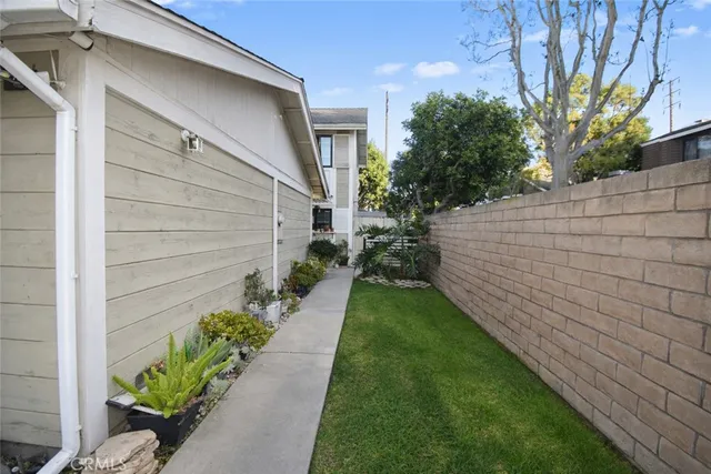 a view of a backyard with potted plants